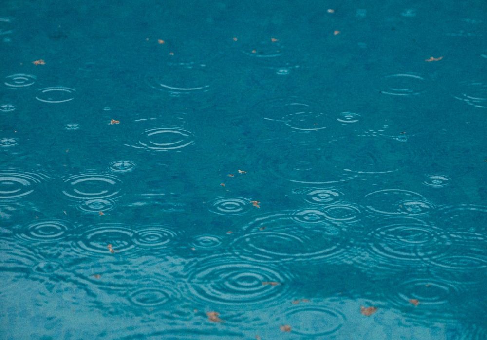 rain drops on blue water