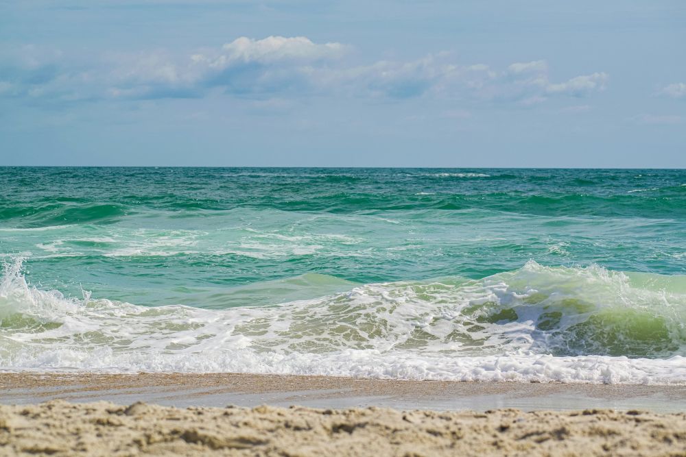 view from the sand of the surf and sky at a North Carolina beach